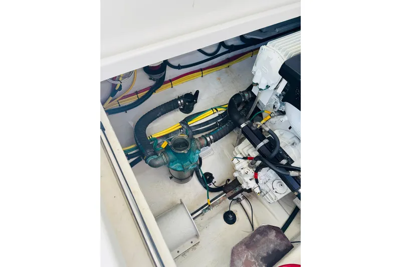 Chance Yacht Photos Pics Engine compartment of a 2007 Back Cove 29 boat, showing hoses and wiring.