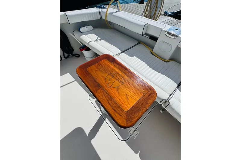 Chance Yacht Photos Pics Luxurious 2007 Back Cove 29 boat interior with elegant wooden table and cushioned seating.