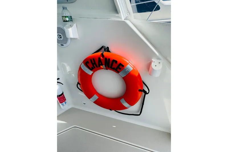Chance Yacht Photos Pics Orange life ring labeled "Chance" on 2007 Back Cove 29 boat interior.