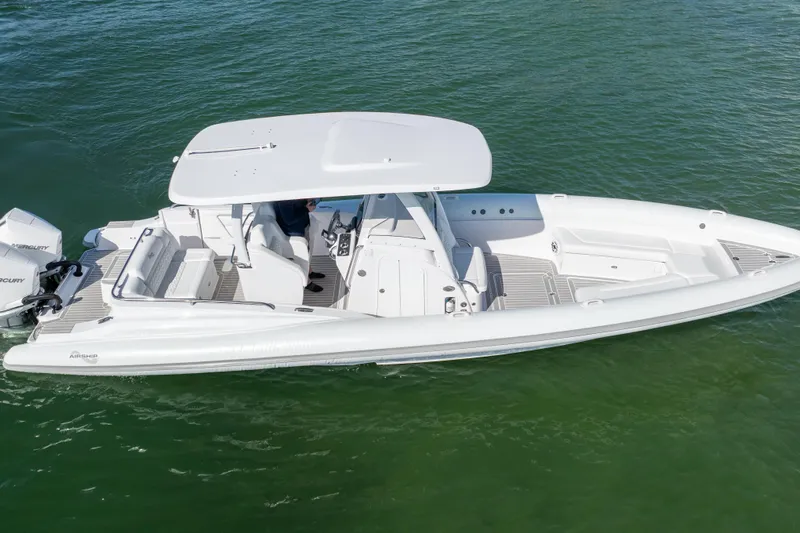  Yacht Photos Pics 2025 Airship 340 boat on water, featuring sleek design and modern amenities.