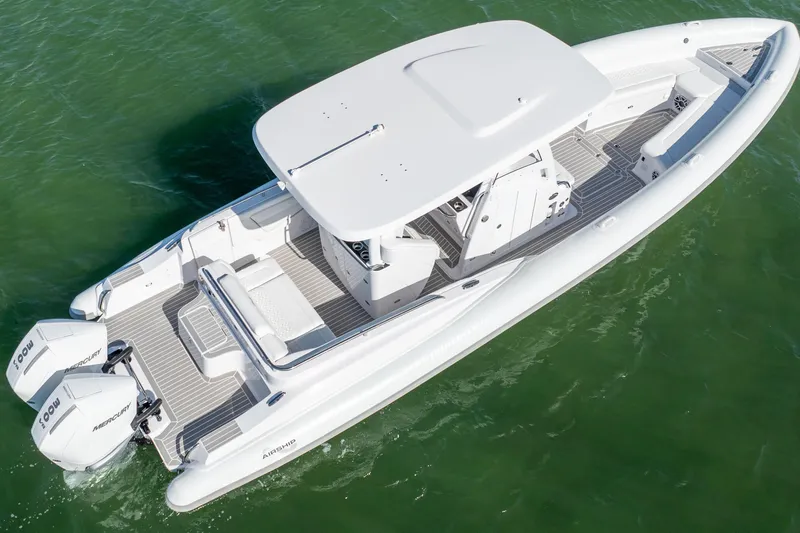  Yacht Photos Pics Modern Airship 340 boat, 2025 model, with dual Mercury engines on green water.