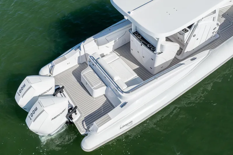  Yacht Photos Pics 2025 Airship 340 boat with dual Mercury engines on calm water.