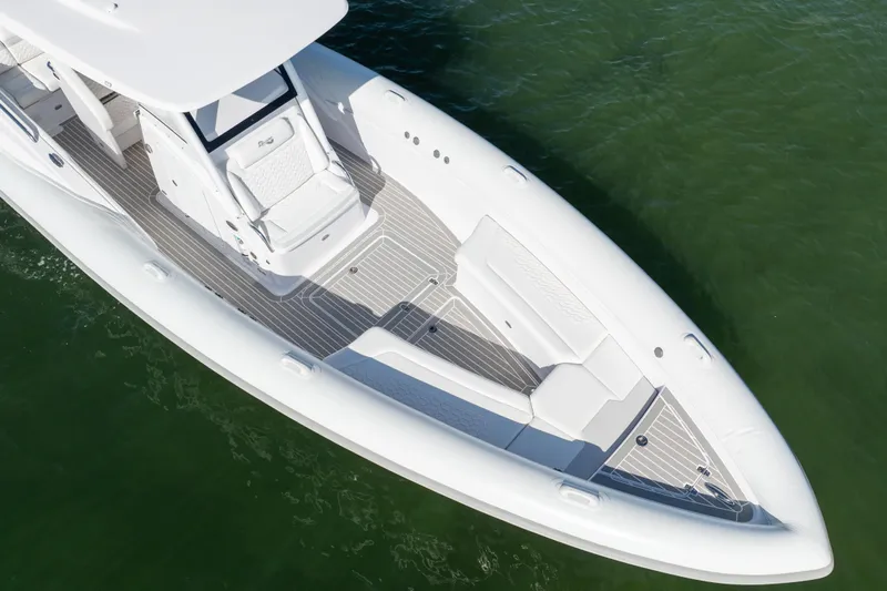  Yacht Photos Pics Aerial view of 2025 Airship 340 boat with sleek white design on green water.