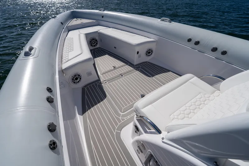  Yacht Photos Pics Luxurious Airship 340 boat interior with white seating, 2025 model, on calm water.