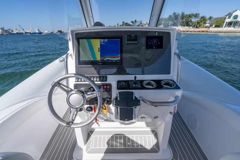  Yacht Photos Pics Cockpit of 2025 Airship 340 boat with modern navigation system and steering wheel.