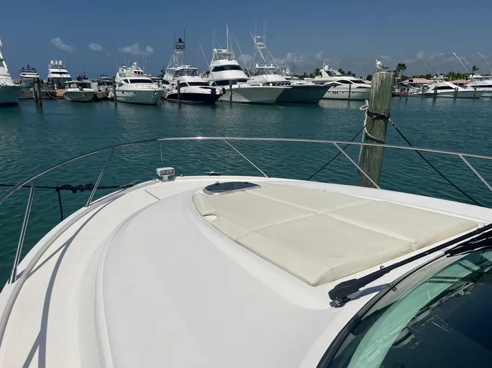 B.u.b. Yacht Photos Pics 2016 Tiara Yachts 44 Coupe at marina with other boats in background.