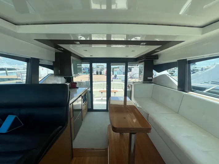 B.u.b. Yacht Photos Pics Interior of 2016 Tiara Yachts 44 Coupe with modern seating and dining area.