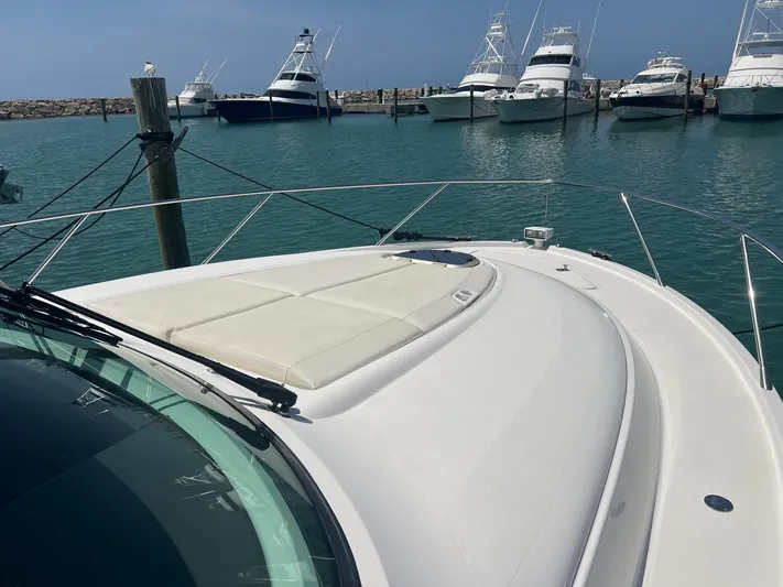 B.u.b. Yacht Photos Pics 2016 Tiara Yachts 44 Coupe docked in a marina with other boats.