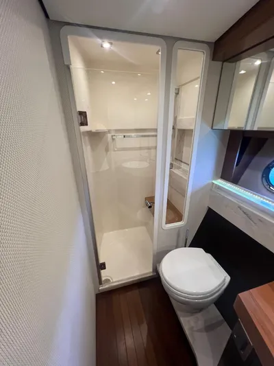 B.u.b. Yacht Photos Pics 2016 Tiara Yachts 44 Coupe bathroom with modern fixtures and shower.