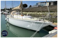 1976 BOUVIER JOUFFRAY BILINGA sailboat docked in a marina, sunny day.