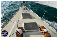 Sailing yacht BOUVIER/JOUFFRAY BILINGA 1976, deck view with ocean backdrop.