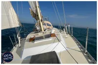 Sailing yacht BOUVIER/JOUFFRAY BILINGA 1976 on open sea, clear sky, ideal conditions.