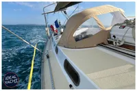 Sailing yacht BOUVIER / JOUFFRAY BILINGA 1976 on open sea with French flag.