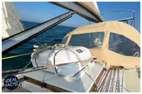 Sailing yacht BOUVIER/JOUFFRAY BILINGA 1976 on open sea with safety equipment.