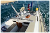 1976 BOUVIER JOUFFRAY BILINGA yacht sailing on open sea with French flag.