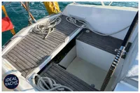 Cockpit of 1976 BOUVIER/JOUFFRAY BILINGA yacht with wooden decking and coiled ropes.