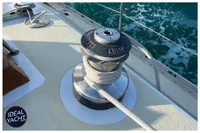 Sailboat deck with winch and ropes, BOUVIER/JOUFFRAY BILINGA 1976 model, ocean background.