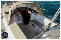 1976 BOUVIER JOUFFRAY BILINGA sailboat cockpit with canopy, ropes, and ocean view.