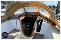 Cockpit of 1976 Bouvier/Jouffray Bilinga yacht with tan canopy and nautical equipment.