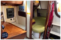 Cozy interior of 1976 BOUVIER/JOUFFRAY BILINGA yacht with wooden furnishings.