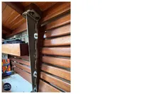 Wooden interior detail of a 1976 BOUVIER/JOUFFRAY BILINGA yacht with metal support.