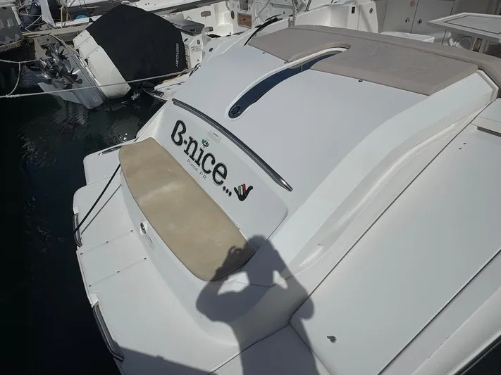  Yacht Photos Pics 2015 Pursuit SC 365i Sport Coupe at marina, rear view with "B-nice" text.