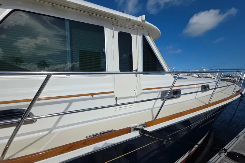 Vertical Yacht Photos Pics 2017 Sabre 48 Salon Express yacht docked under a clear blue sky.