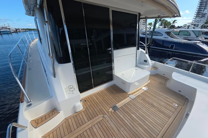 Vertical Yacht Photos Pics 2017 Sabre 48 Salon Express yacht with teak deck at marina.