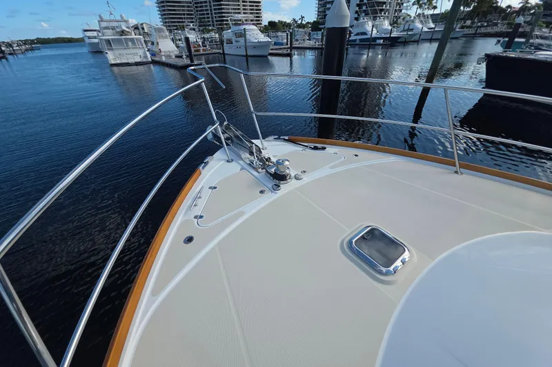 Vertical Yacht Photos Pics Bow of 2017 Sabre 48 Salon Express yacht docked in marina.