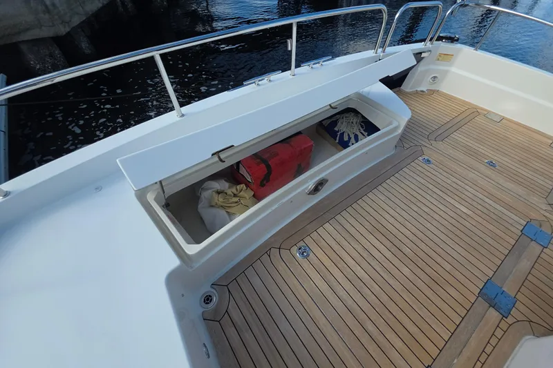 Vertical Yacht Photos Pics Open storage compartment on 2017 Sabre 48 Salon Express yacht deck.