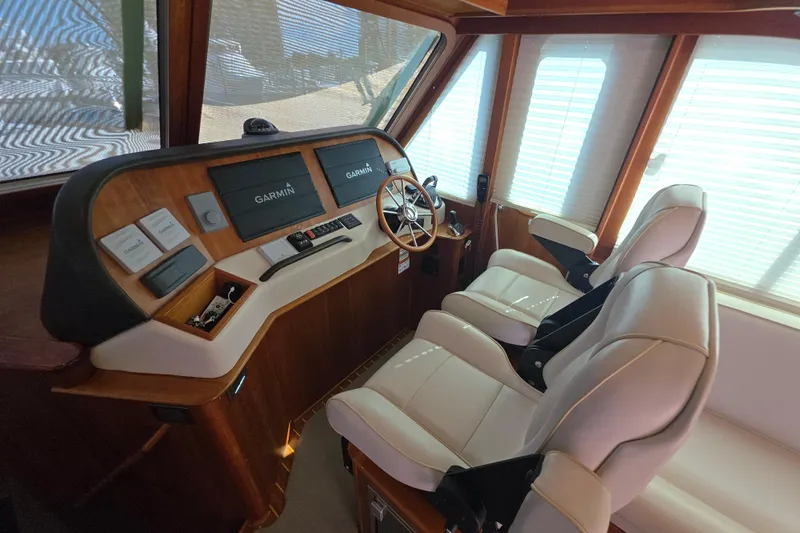 Vertical Yacht Photos Pics 2017 Sabre 48 Salon Express helm with Garmin navigation and luxurious seating.