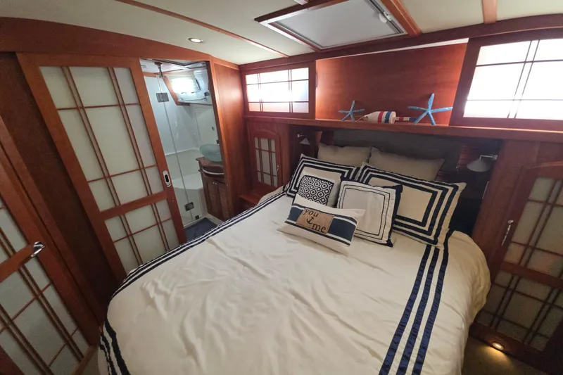 Vertical Yacht Photos Pics Luxurious bedroom interior of 2017 Sabre 48 Salon Express yacht with nautical decor.