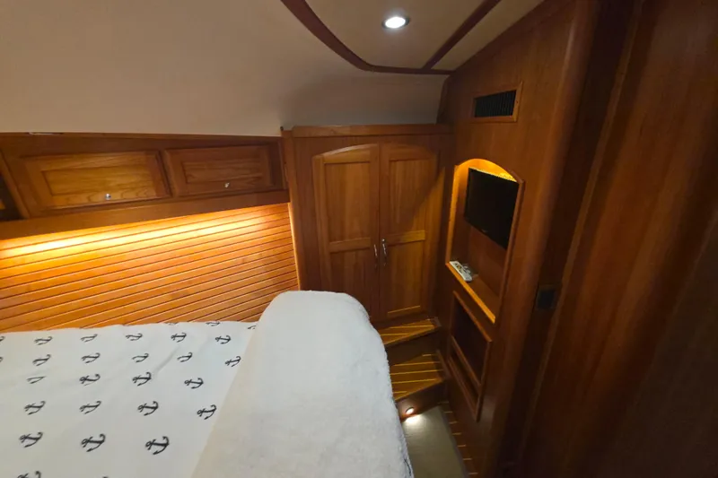 Vertical Yacht Photos Pics Luxurious wood interior of 2017 Sabre 48 Salon Express yacht cabin.