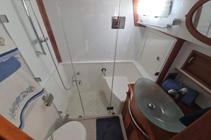 Vertical Yacht Photos Pics Luxurious bathroom in 2017 Sabre 48 Salon Express yacht with glass sink and shower.