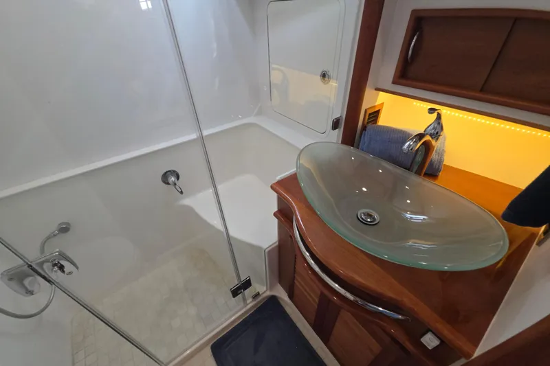 Vertical Yacht Photos Pics Luxurious bathroom in 2017 Sabre 48 Salon Express yacht with glass sink and shower.