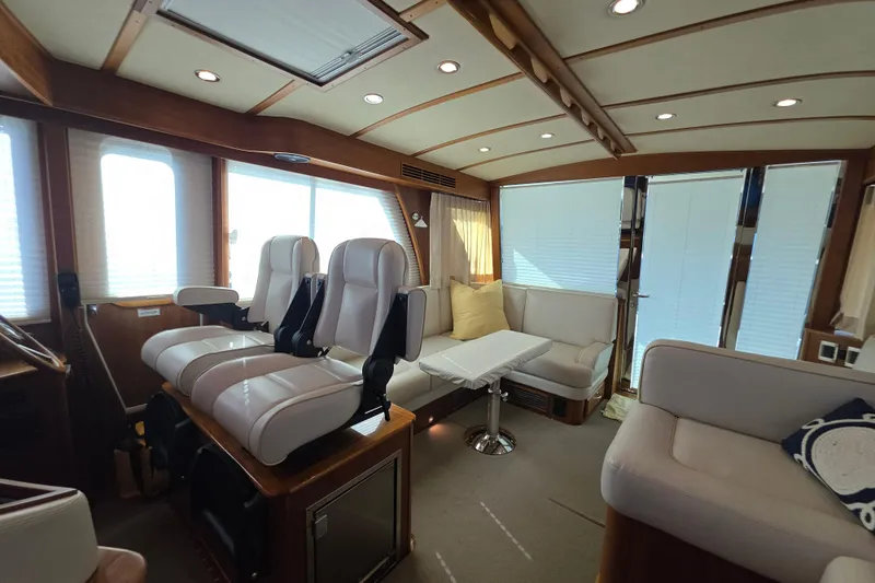 Vertical Yacht Photos Pics Interior of 2017 Sabre 48 Salon Express yacht with plush seating and modern design.