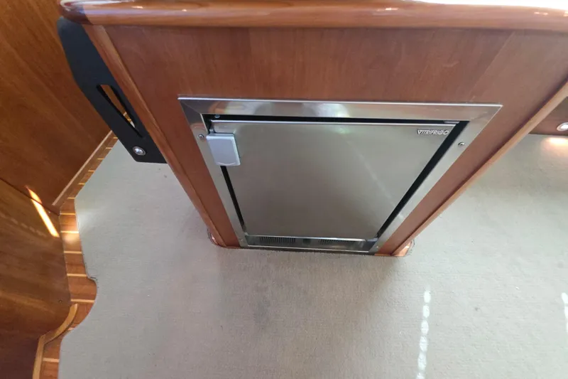 Vertical Yacht Photos Pics Built-in fridge on 2017 Sabre 48 Salon Express yacht interior.