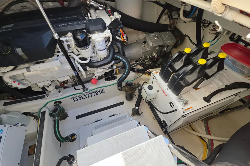 Vertical Yacht Photos Pics Engine room of 2017 Sabre 48 Salon Express with visible machinery and equipment.