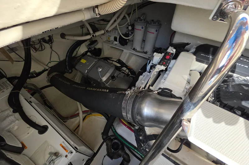 Vertical Yacht Photos Pics Engine room of 2017 Sabre 48 Salon Express, showcasing mechanical components and piping.