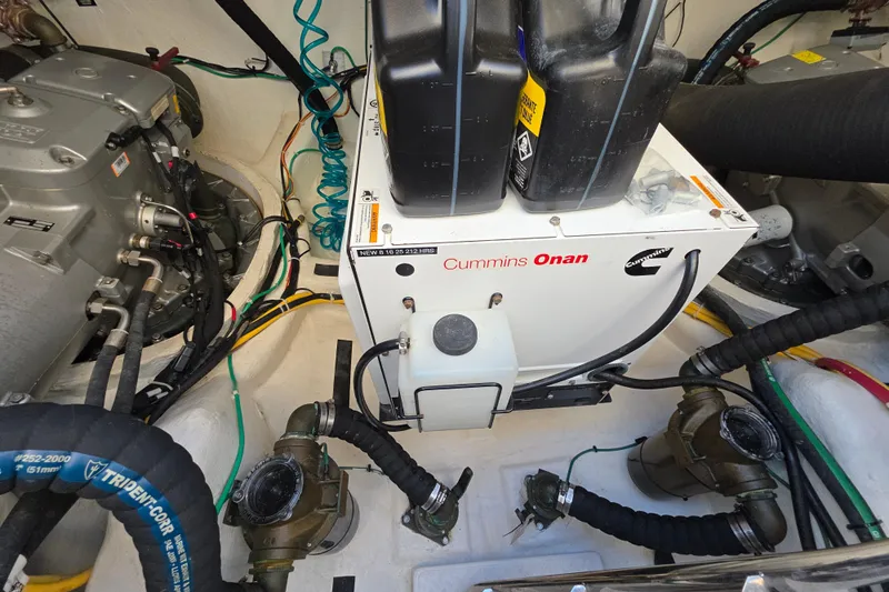 Vertical Yacht Photos Pics Engine room of 2017 Sabre 48 Salon Express with Cummins Onan generator.