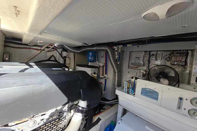 Vertical Yacht Photos Pics Engine room of 2017 Sabre 48 Salon Express with mechanical components and wiring.