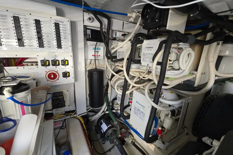 Vertical Yacht Photos Pics Engine room of 2017 Sabre 48 Salon Express with complex wiring and equipment.