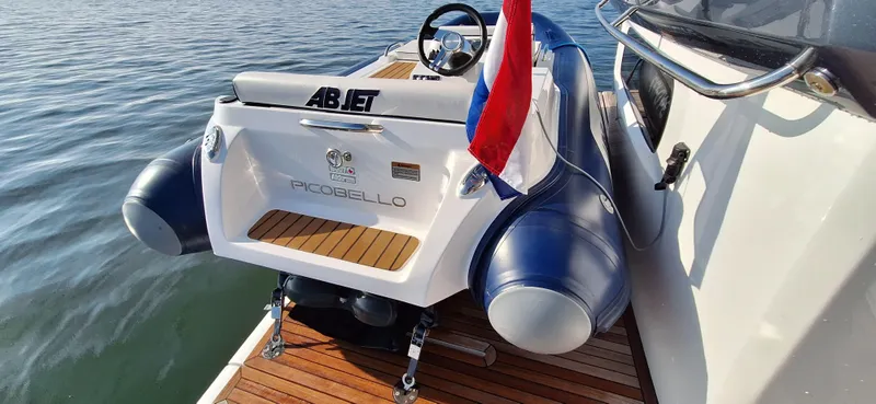 Bella Vita Yacht Photos Pics Azimut Magellano 66 yacht with ABJET tender, docked on calm water, 2020 model.