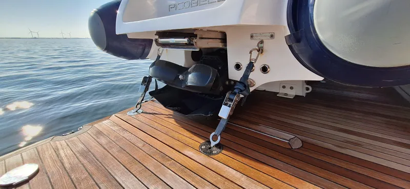 Bella Vita Yacht Photos Pics Azimut Magellano 66 yacht stern with wooden deck, 2020 model, on calm water.