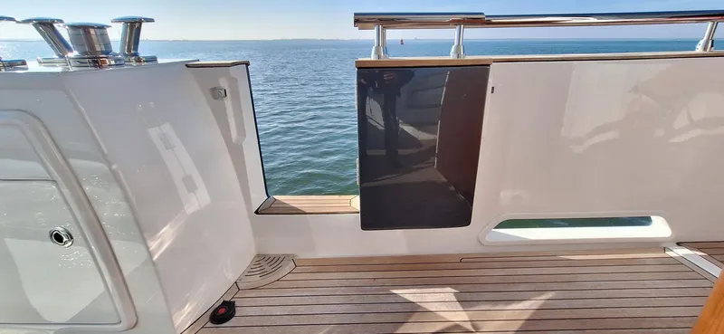 Bella Vita Yacht Photos Pics Azimut Magellano 66 yacht deck, 2020 model, with ocean view and sleek design.