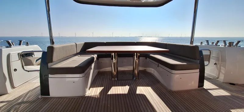 Bella Vita Yacht Photos Pics Outdoor seating area on 2020 Azimut Magellano 66 yacht with ocean view.