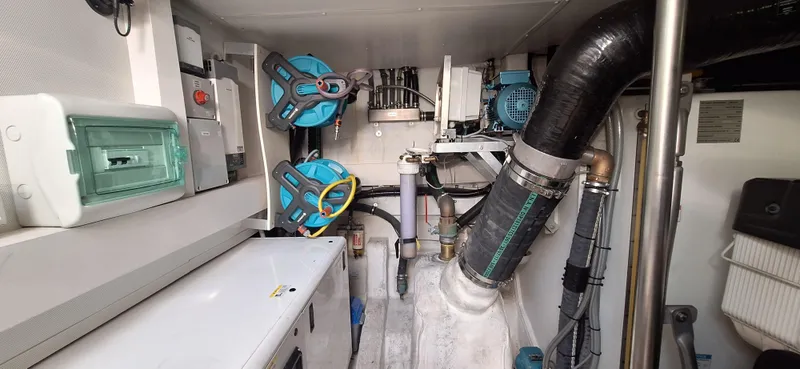 Bella Vita Yacht Photos Pics Engine room of 2020 Azimut Magellano 66 yacht, featuring mechanical and electrical components.