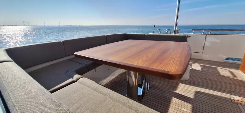 Bella Vita Yacht Photos Pics Outdoor seating area on 2020 Azimut Magellano 66 yacht with ocean view.
