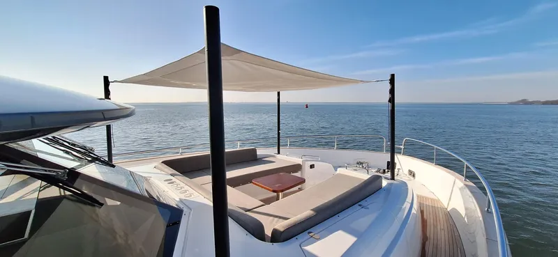 Bella Vita Yacht Photos Pics Azimut Magellano 66 yacht deck with sunshade, overlooking serene ocean view, 2020 model.