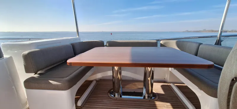 Bella Vita Yacht Photos Pics Luxury seating area on 2020 Azimut Magellano 66 yacht with ocean view.